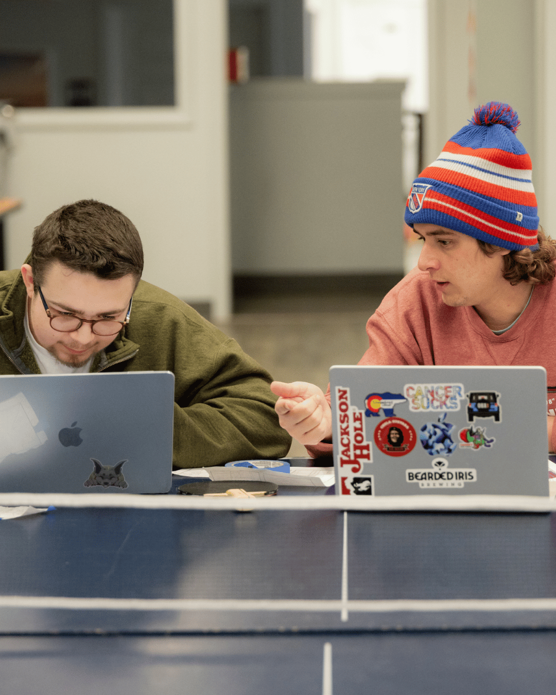Woodhouse Student and Teacher Studying together on ping pong table